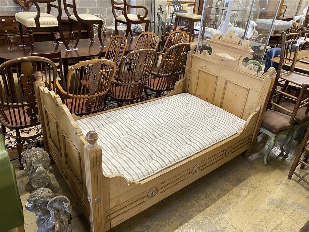 A 19th century Continental pine single bedstead with new mattress, width 115cm, length 190cm